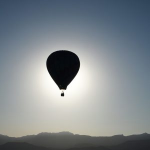 Hot air balloon floating in horizon