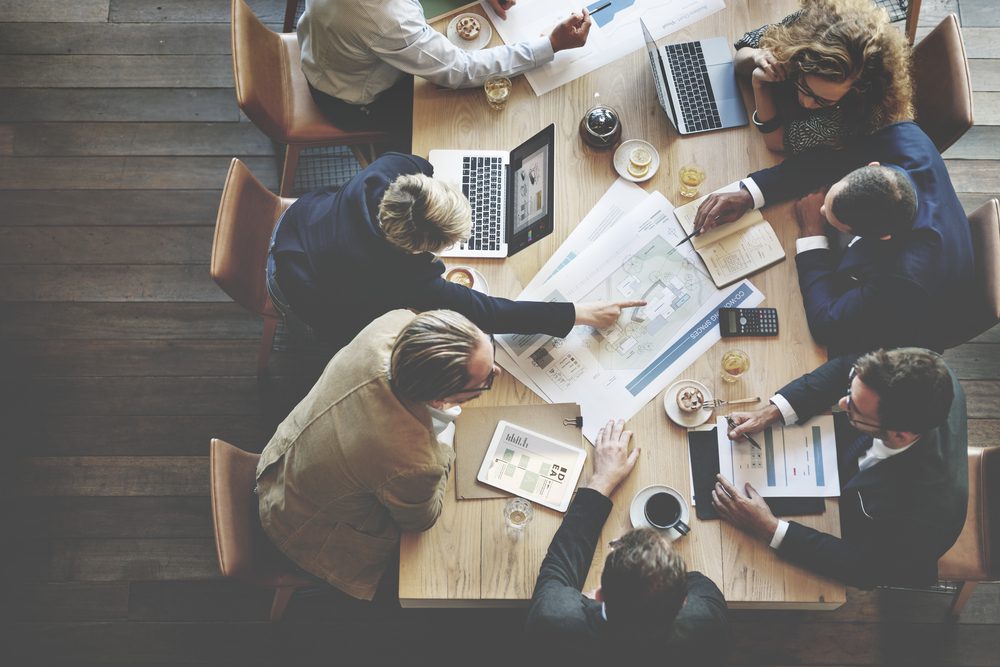 Content marketers planning their content strategy at conference table