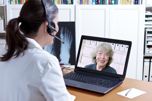 Female doctor teleconferencing with a patient 