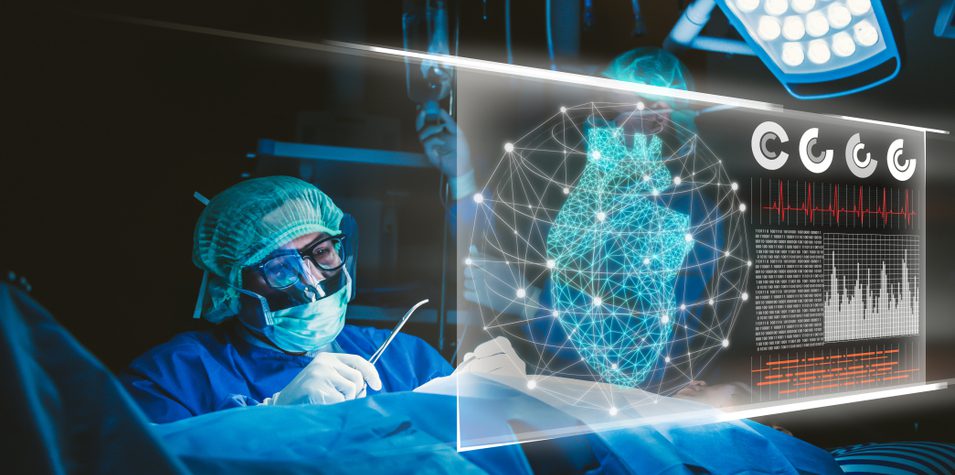 A surgeon inspecting his patient's heart status displayed on a screen