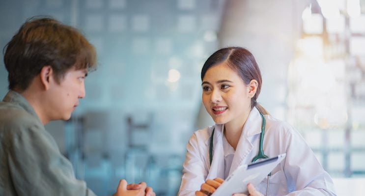 Female doctor communicating with a patient