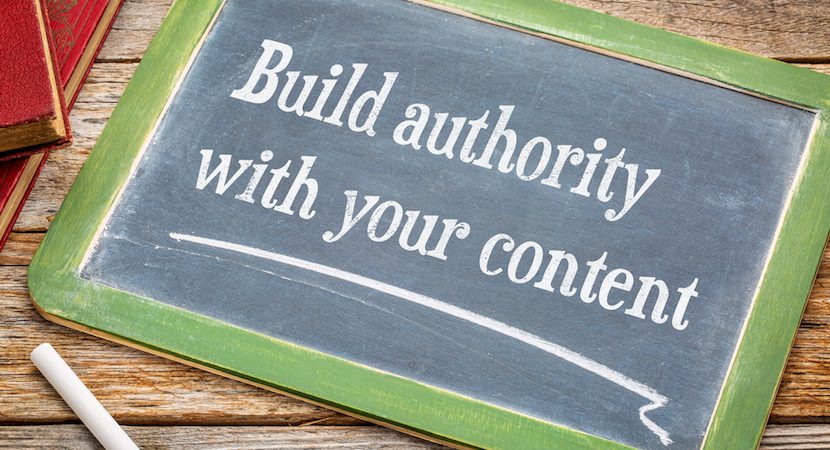 Chalk board displaying the words "Build authority with your content"