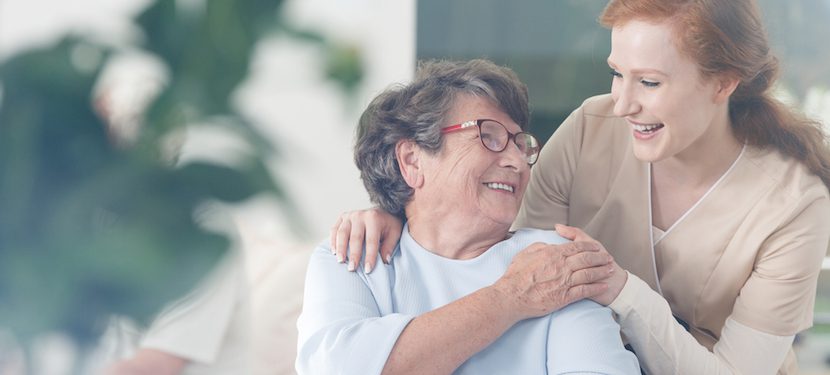 Elderly woman cherishing the presence of her daughter.