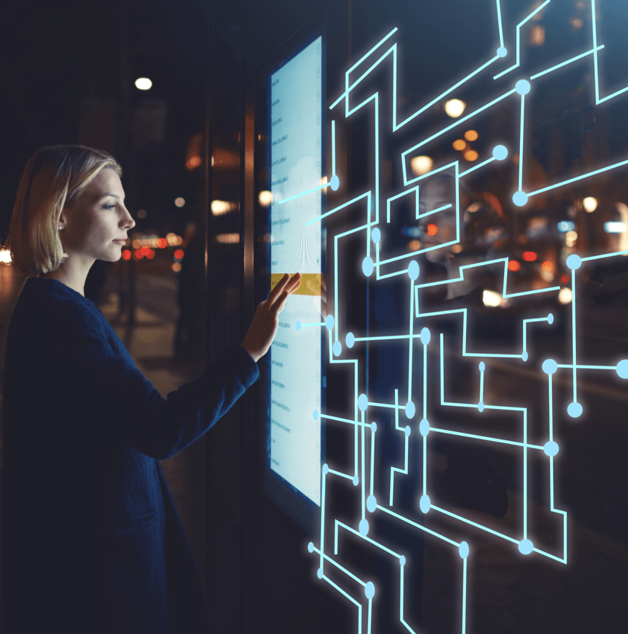 Woman interacting with a high-tech touch screen.