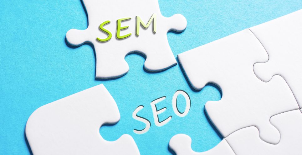 Puzzle pieces with the words "SEM" and "SEO" on them.