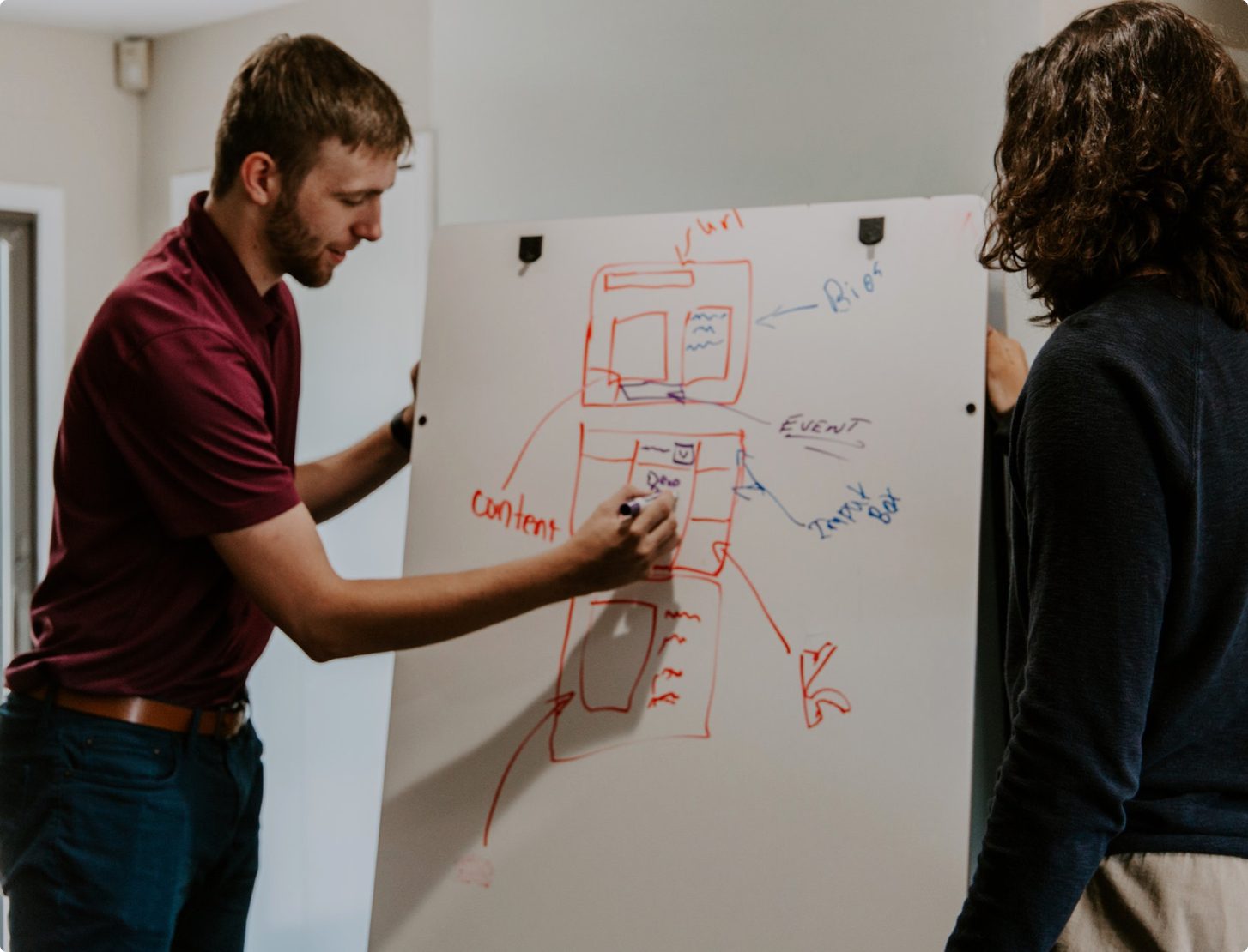 Business man pushing a "customer engagement" button on digital interface