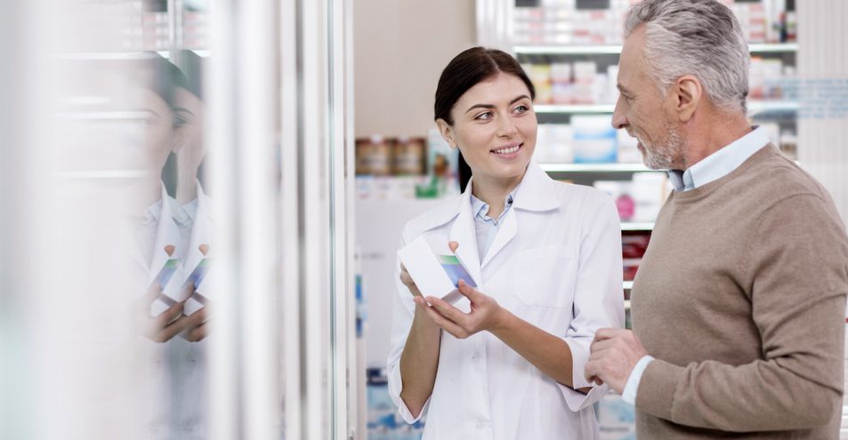 Man and Woman discussing in a pharmacy.