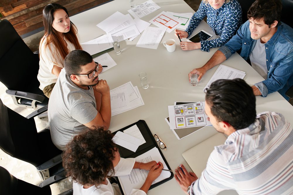 Marketing agency team discussing around a conference table