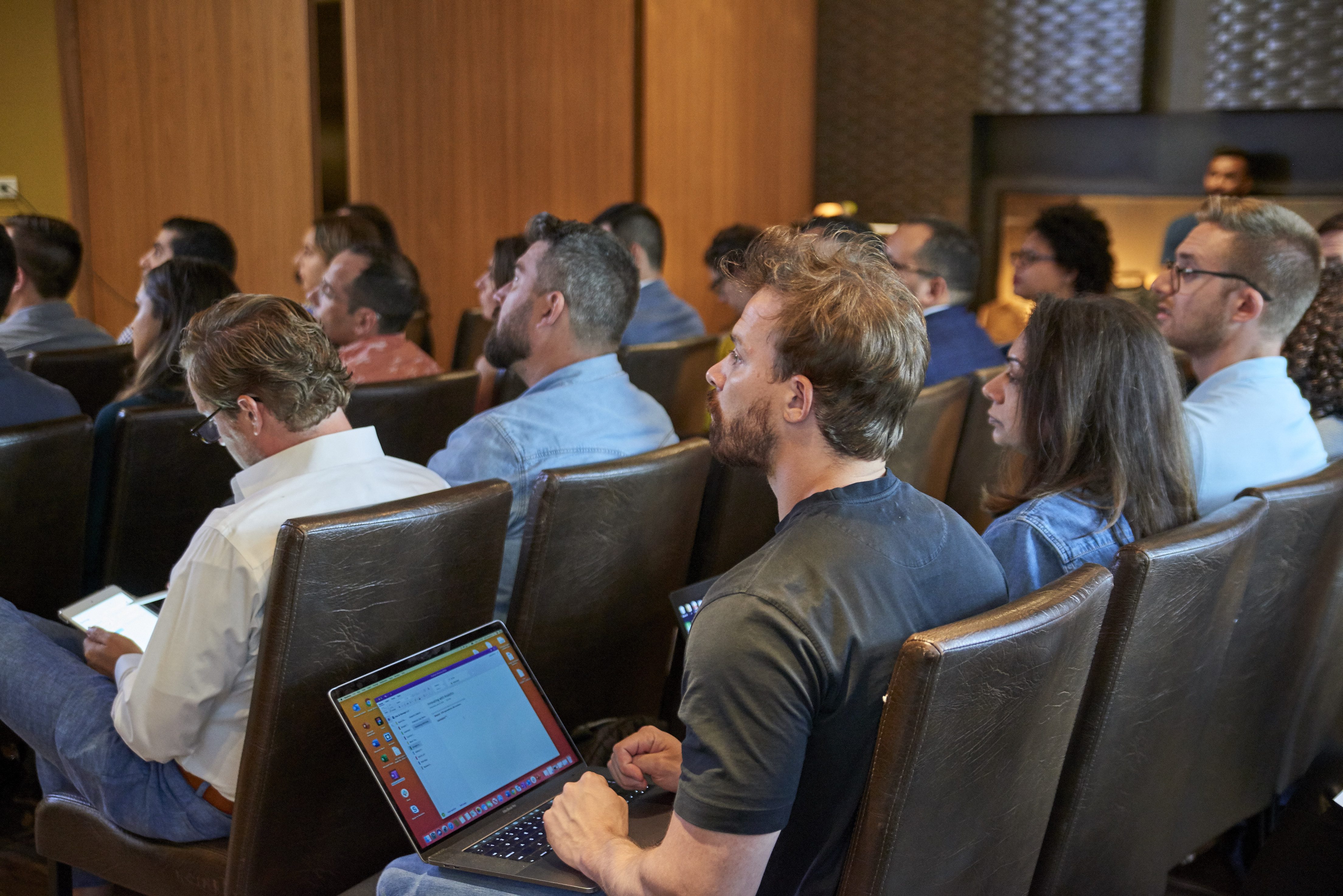 Man in the audience of a Digital Authority Partners' event