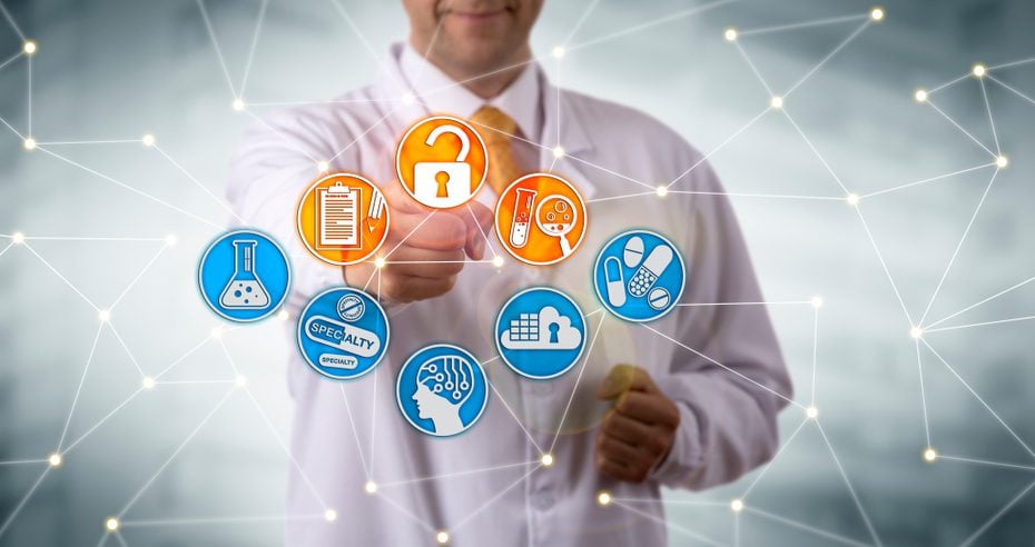 Doctor pointing at a interconnected web of healthcare icons