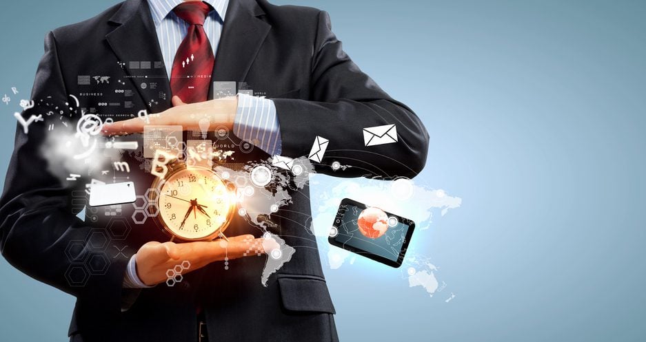 Business man holding a clock, surrounded by email symbols