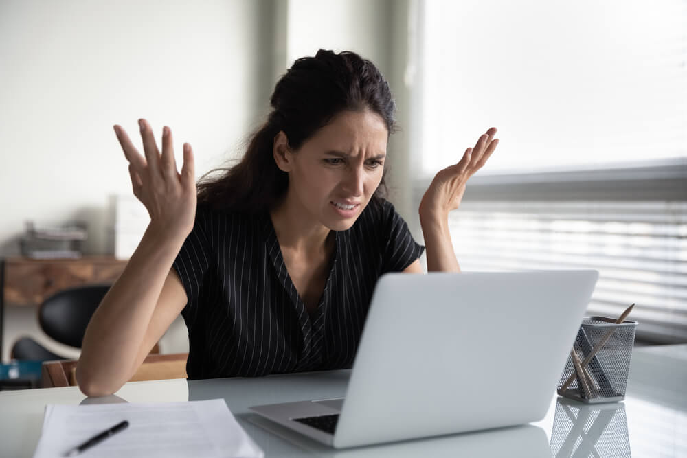 annoy email_What is wrong. Anxious angry hispanic female splash hands unable to access database on laptop forgetting password having weak wifi signal. Mad shocked young woman worker losing job result on broken pc