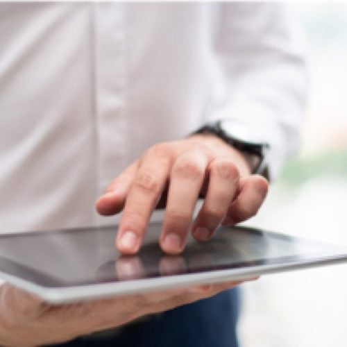 Man touching a tablet