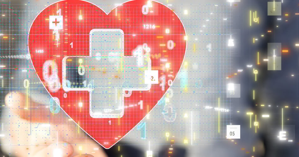 Hand holding a digitized heart icon with a healthcare cross symbol inside it