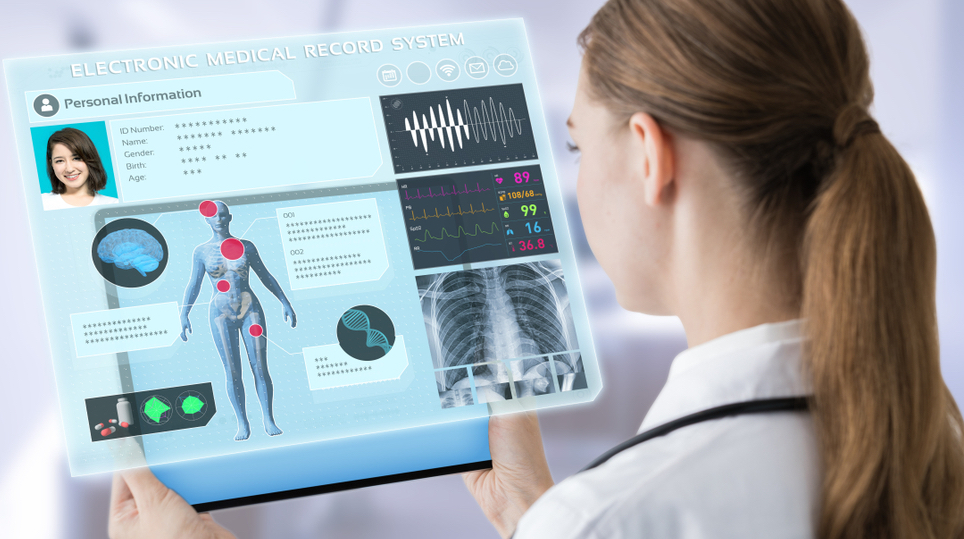 Female doctor looking at an electronic medical record system on a tablet