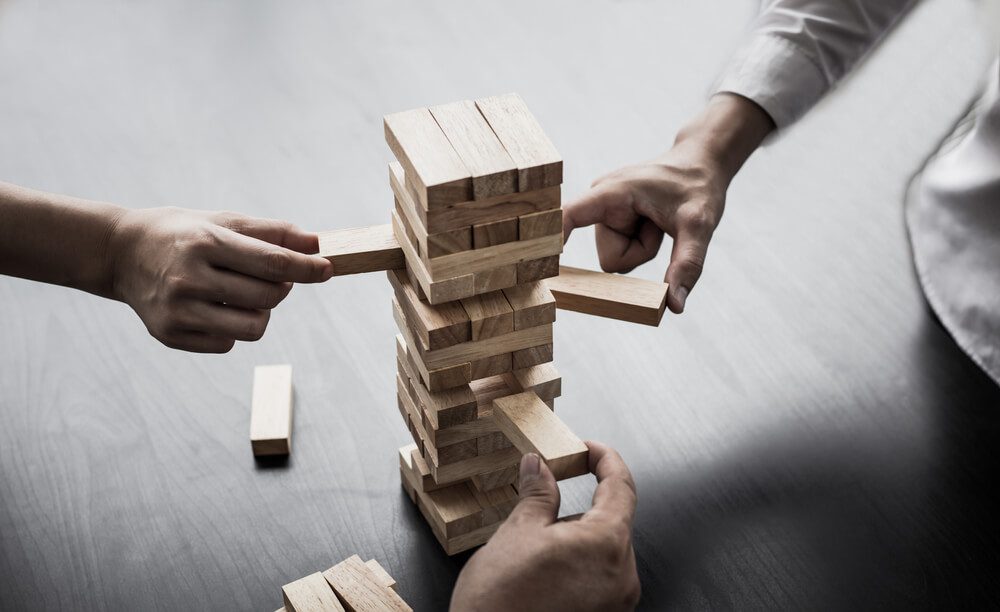 Who needs a Fractional CMO - Business growth with wooden blocks concept.