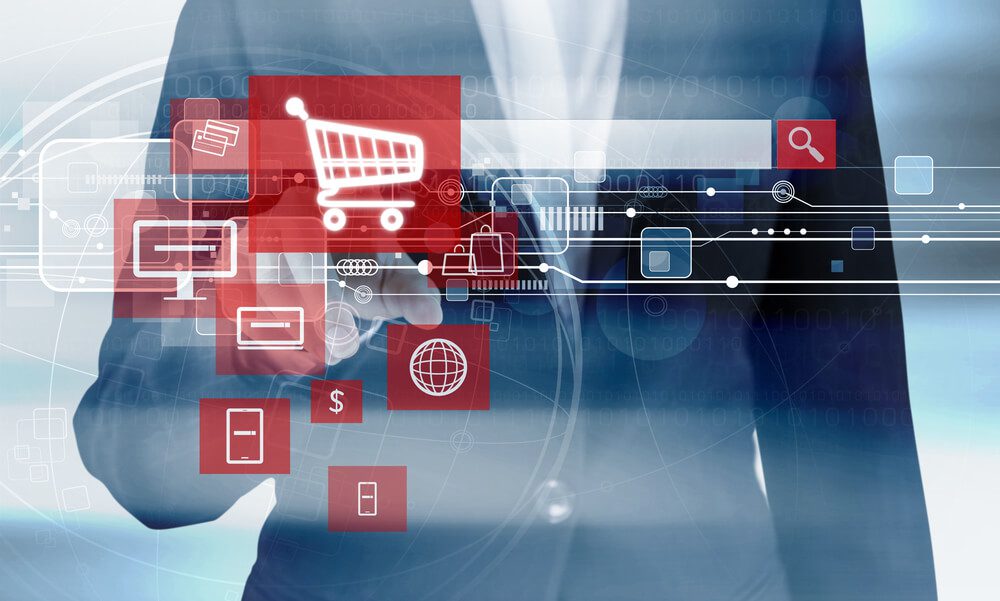 A business man clicks a red shopping cart icon part of Magento development for SMBs