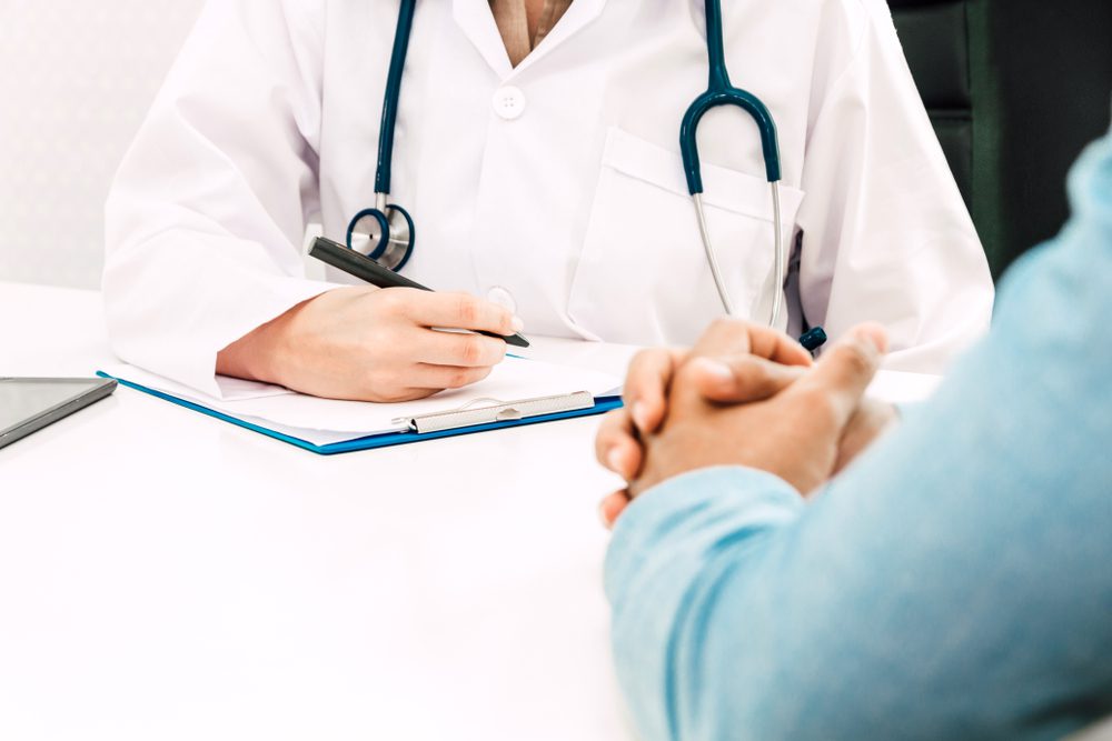 plastic surgeon_Doctor discussing and consulting with male patien on doctors table in hospital.healthcare and medicine