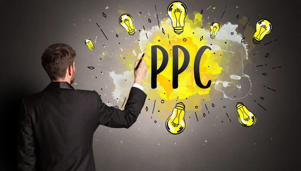 ppc_businessman drawing colorful light bulb with PPC abbreviation, new technology idea concept
