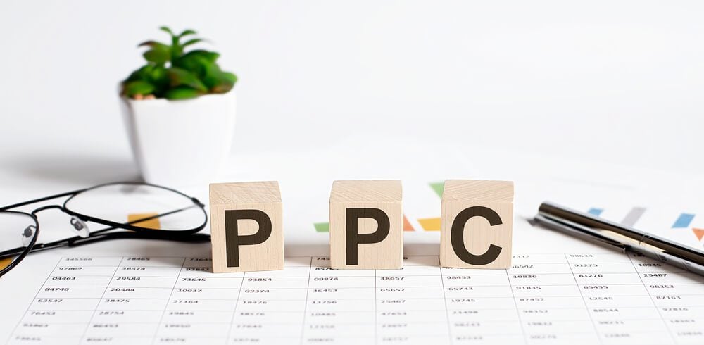 ppc_The Word PPC Formed By Wooden Blocks On A White Table on chart