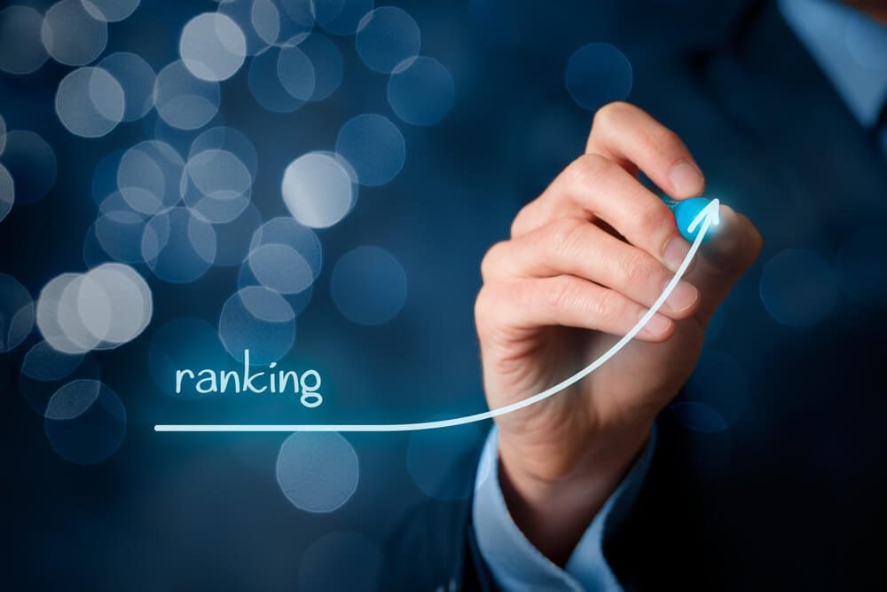seo rankings_Increase ranking concept. Businessman draw plan to increase ranking of his company or website, bokeh in background.