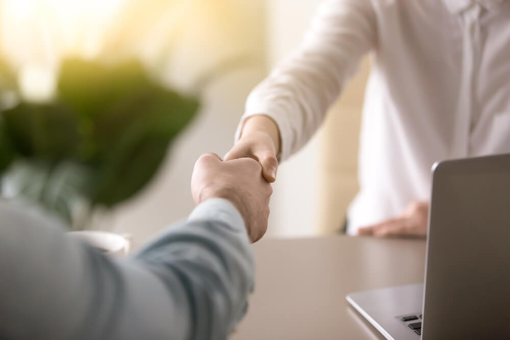 consulting agency_Close up of a handshake, male and female hands shaking as a symbol of effective negotiations, making agreement, greeting business partner or mutual respect and gender equality in relationships