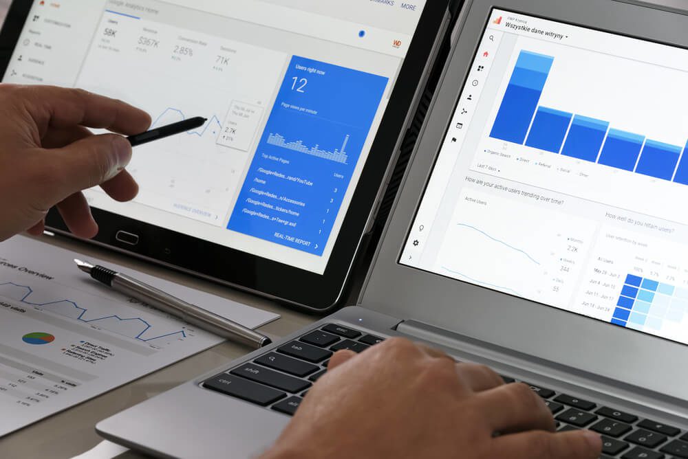 SEO_Krynica-Zdroj, Poland - July 11, 2017: Businessman using Google Analytics in the office on his computers. Google Analytics is the most famous application for advanced web traffic analysis in the world