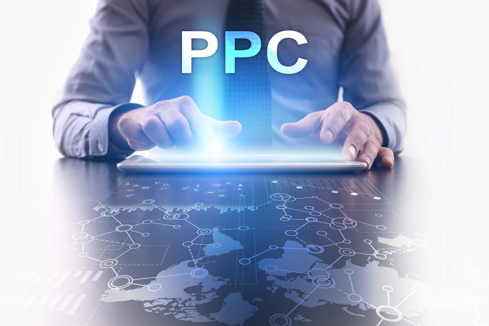 PPC or SEO? Do Dentists Have To Choose? 2 pay per click advertising_Businessman is using tablet pc and selecting ppc