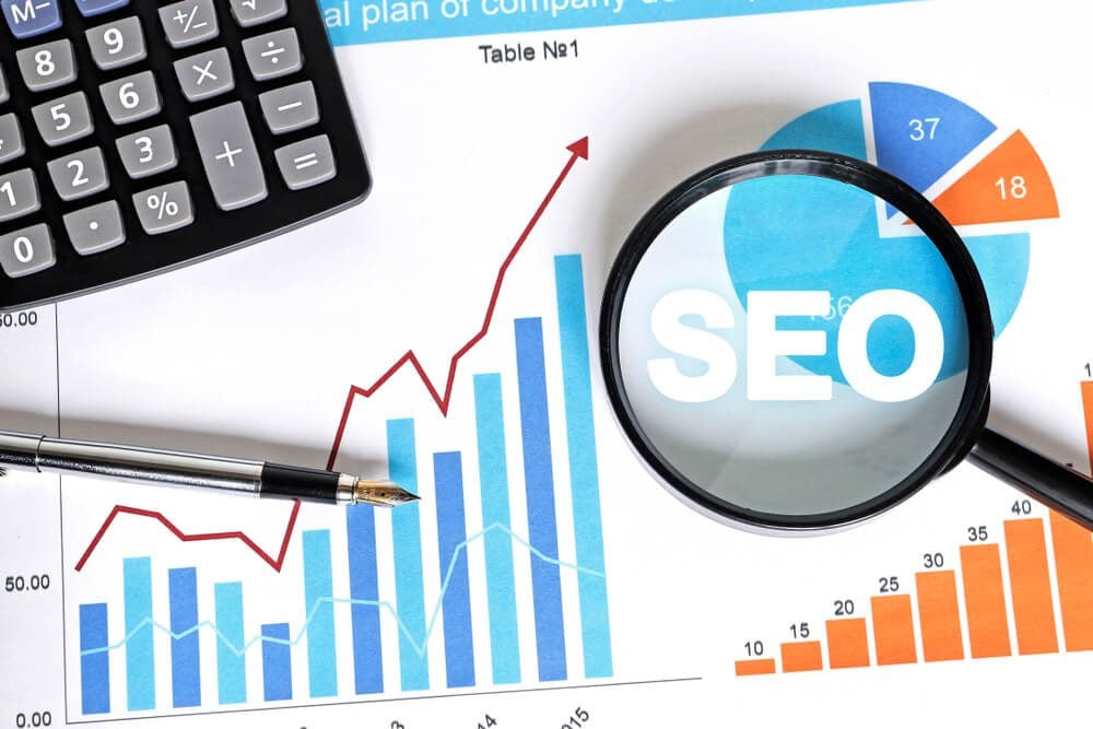 invest in seo_Business search loupe magnifier seo chart web diagram.