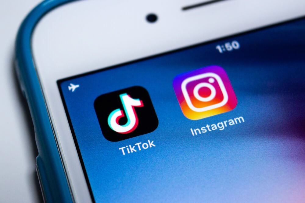 tiktok instagram_Kumamoto, Japan - Aug 11 2020 : TikTok and Instagram apps on iPhone on white background. In August 2020, Instagram has launches new video feature called Instagram Reels to rival TikTok