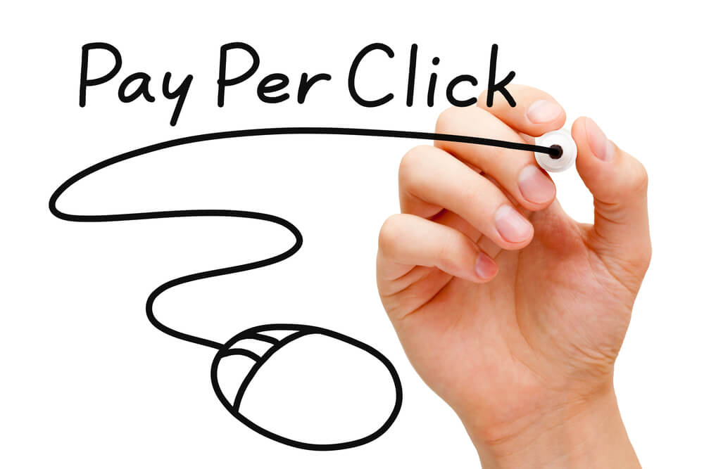 pay per click_Hand sketching Pay Per Click mouse concept with black marker on transparent wipe board.