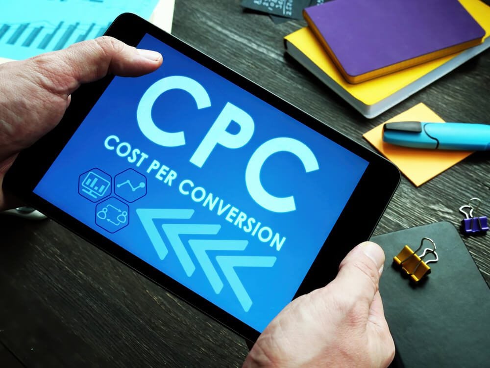 cost per conversion_Cost Per Conversion CPC sign on the tablet.