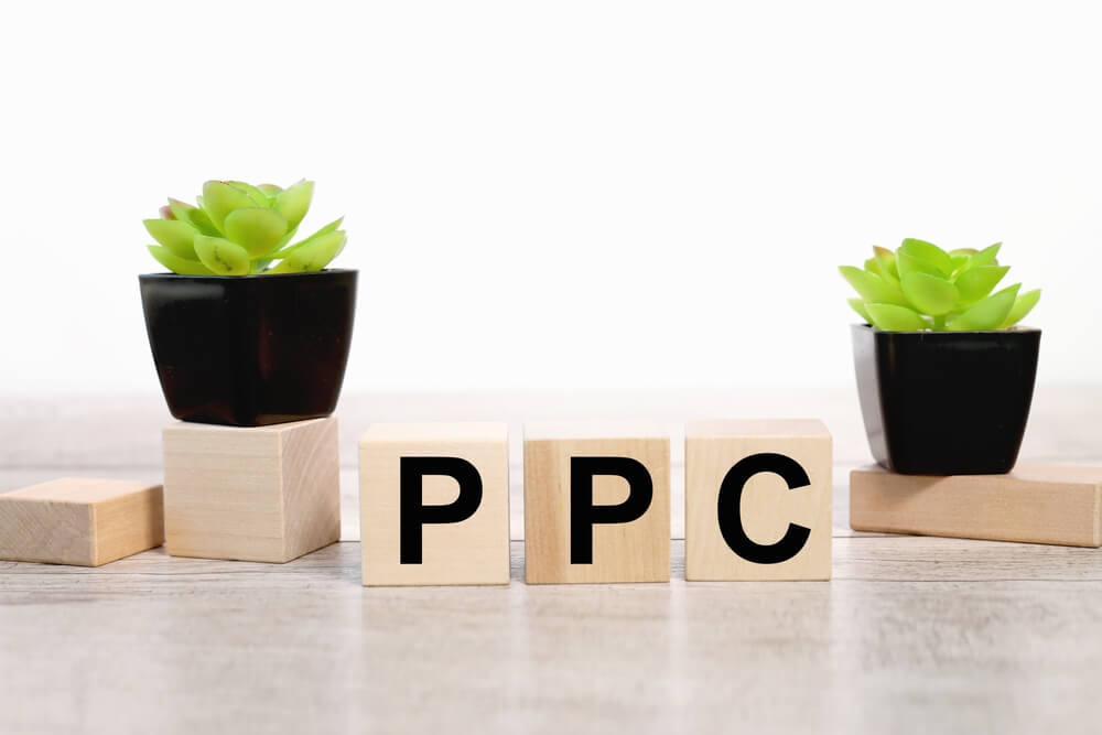 ppc_wood blocks with words PPC pay per concept and click marker.