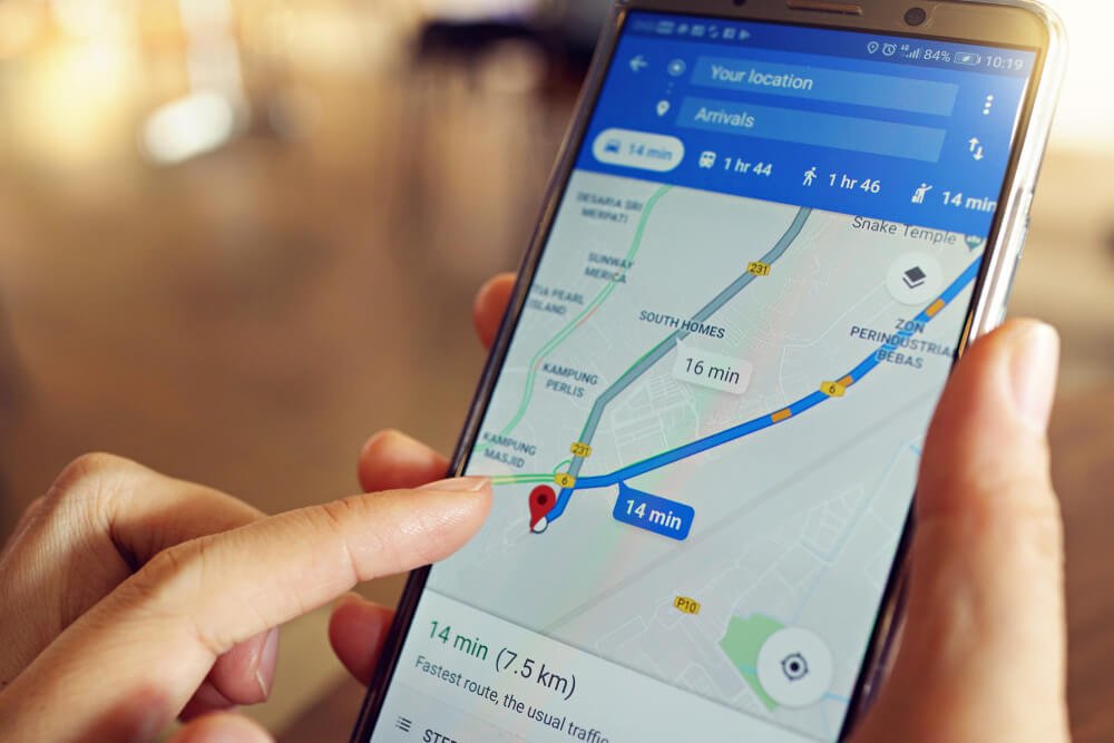 google maps_Penang, Malaysia - April 6, 2018: A female is using Google Maps service on smartphone at cafe. Google Maps is most popular mapping service for mobile provided by Google.