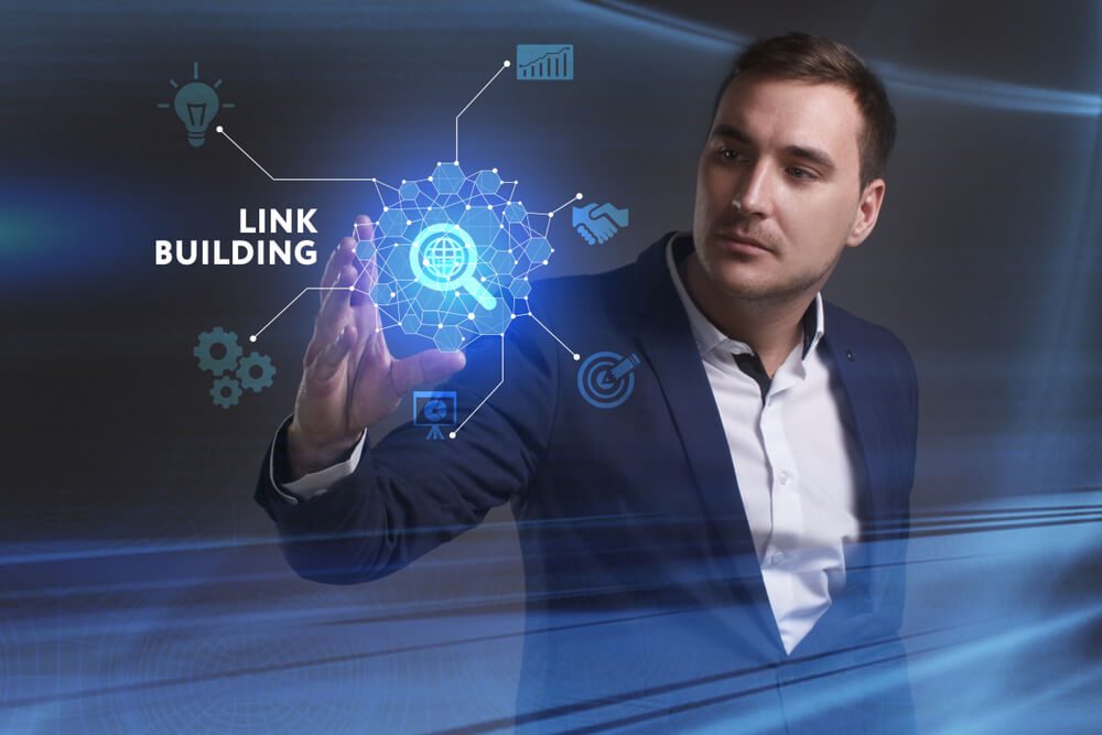 link building_Business, Technology, Internet and network concept. Young businessman working on a virtual screen of the future and sees the inscription: Link building