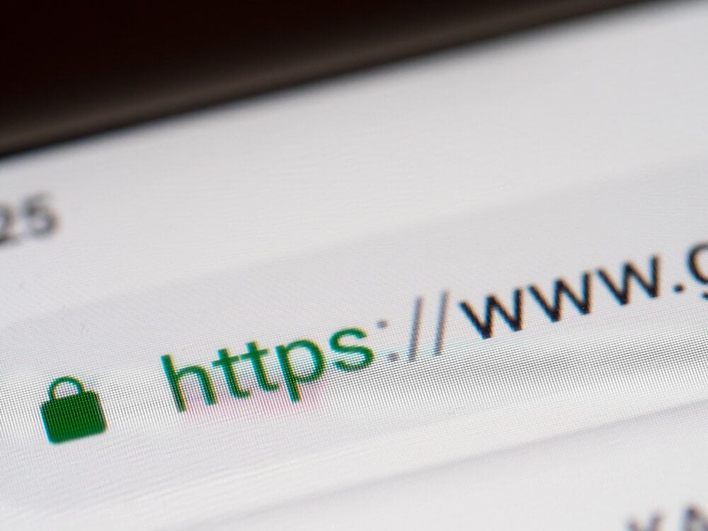 HTTPS_Closeup on smartphone display screen with https and www url. Security concept in search engine and web browser address. Hyper Text Transfer Protocol Secure https. Shallow DOF,