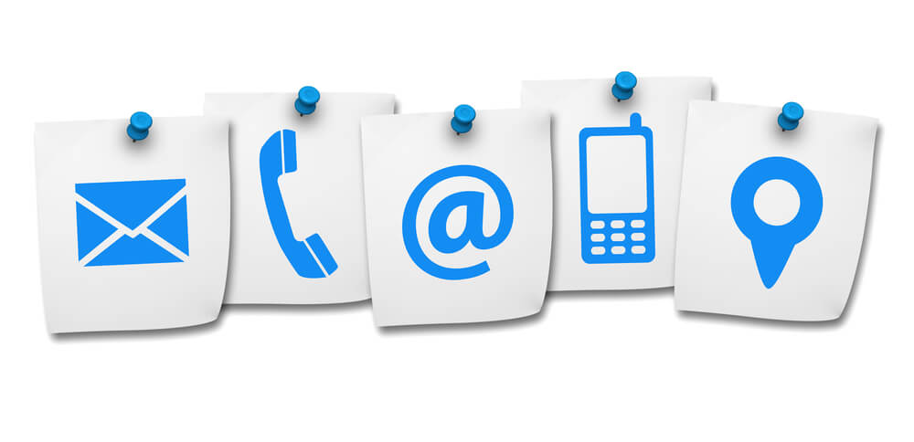contact icons_Website and Internet contact us page concept with contact icons and symbols on five paper post it isolated on white background.
