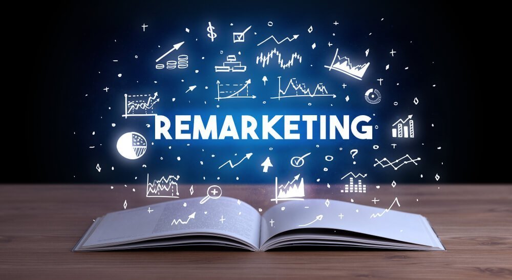 remarketing_REMARKETING inscription coming out from an open book, business concept
