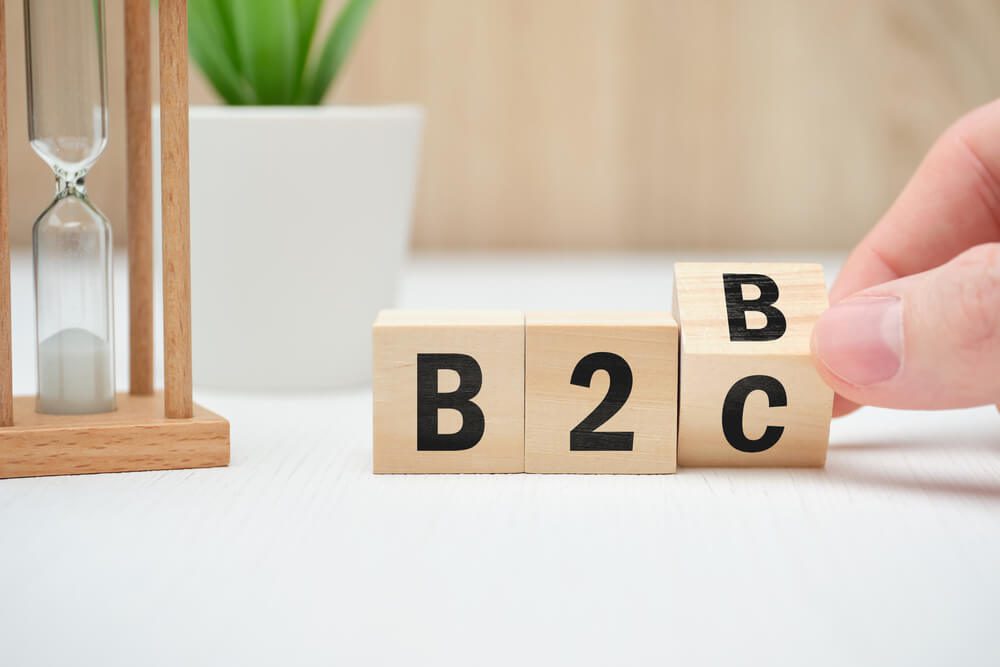 B2B B2C_Business model concept b2b and b2c on wooden blocks. Close up.