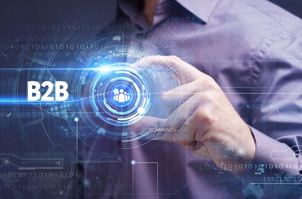 B2B SEO_Business, Technology, Internet and network concept. Young businessman working on a virtual screen of the future and sees the inscription: B2B