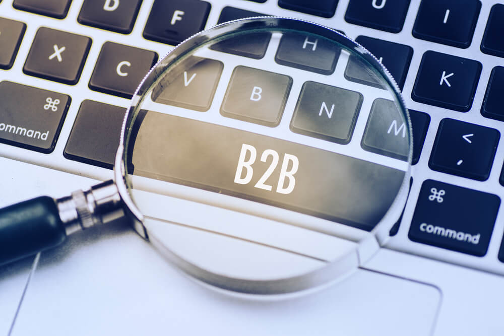 B2B SEO_B2B word written on keyboard view with magnifier glass. Business finance marketing content concept