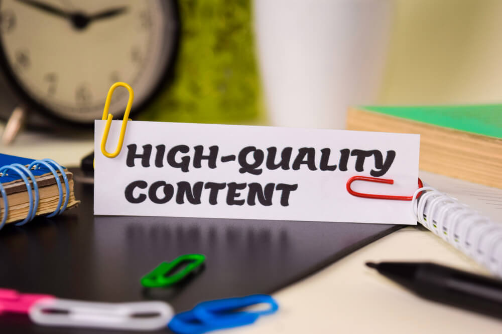 quality content_High-Quality Content on the paper isolated on it desk. Business and inspiration concept