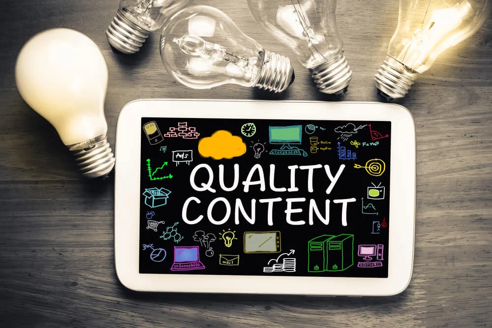 quality content_Quality Content concept on tablet with glowing light bulbs