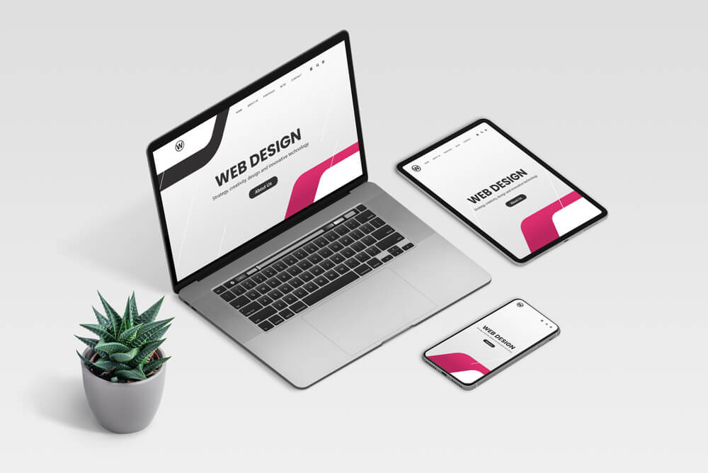 web design seo_Web design studio promo page on laptop, tablet and phone display concept. Isometric view of desk with plant decoration