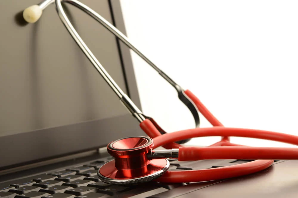 email marketing for healthcare_A stethoscope on a laptop for online healthcare services.