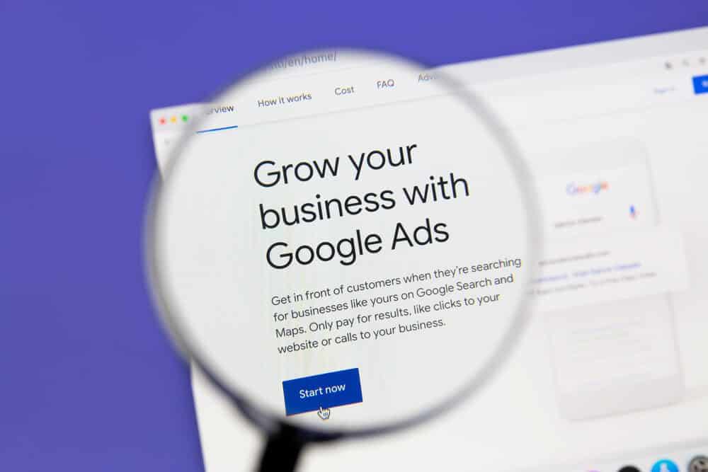 google ads_Ostersund, Sweden - October 7, 2020 Google Ads website under a magnifying glass. Google Ads is an online advertising platform developed by Google.