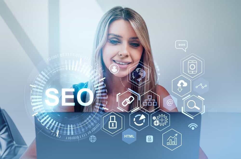 seo ranking_Businesswoman is working on laptop with digital interface with seo, search engine optimization. Concept of modern technology of website analysis, keywording, content, ranking and social media