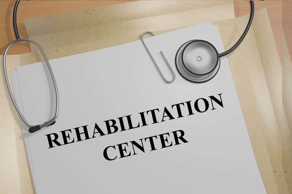 drug rehab center_3D illustration of "REHABILITATION CENTER" title on medical documents. Medical concept.