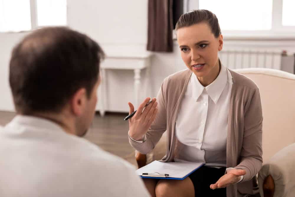 therapists_Positive professional therapist giving advice