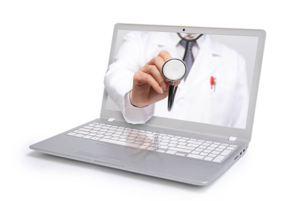 doctors online_Telemedicine concept. Doctor with a stethoscope on the computer laptop screen.